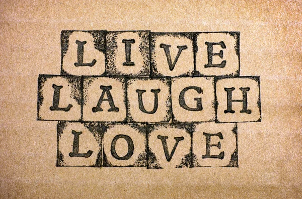 Words Live, Laugh, Love make by black alphabet stamps