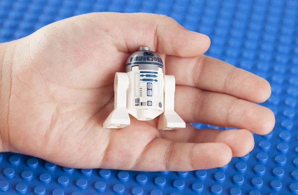LEGO Star wars R2-D2 minifigure in child hand