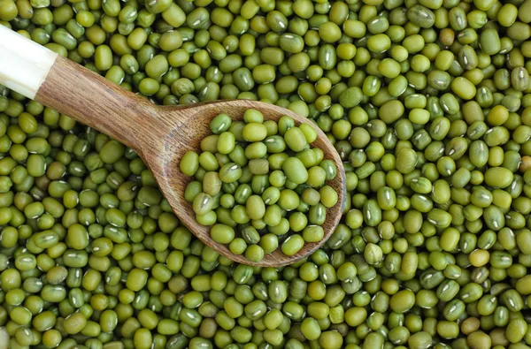 Mung beans (mash) in wooden spoon
