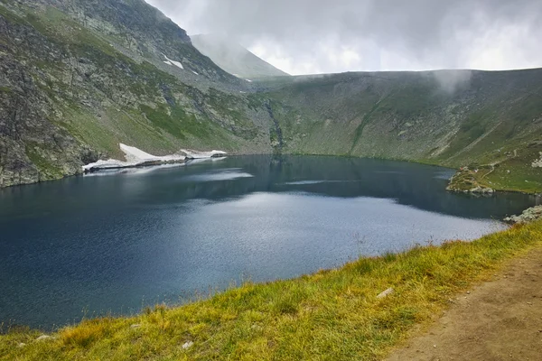 Amazing view of The Eye lake before storm, The Seven Rila Lakes
