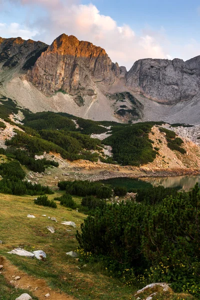 Sunset with Colored in red rock Around Sinanitsa peak and  the lake, Pirin Mountain