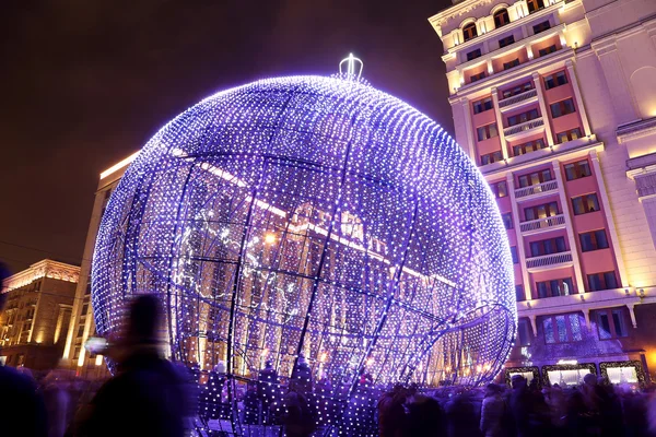 Christmas and New Year holidays illumination and Building of The State Duma of the Federal Assembly of Russian Federation at night, Moscow, Russia