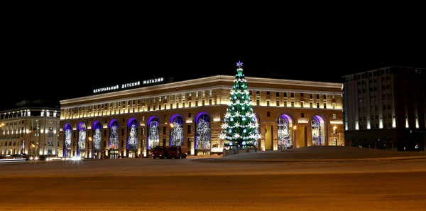 Christmas (New Year holidays) illumination of the Central Children's Store on Lubyanka (inscription in Russian) at night, Moscow, Russia