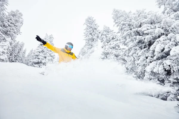 Man in backcountry snowboarding