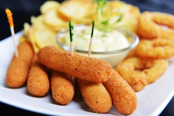Tasty fish sticks and potatoes