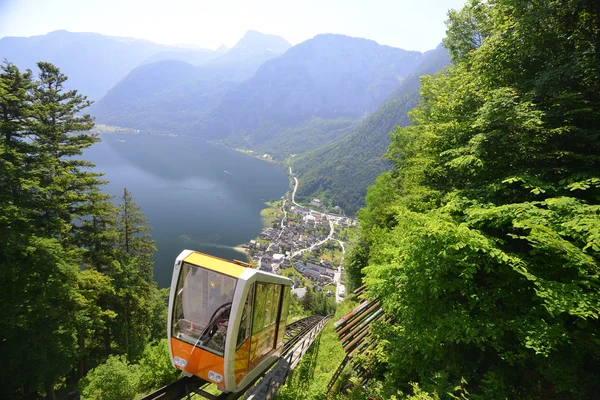 Funicular and village at foot of mountains