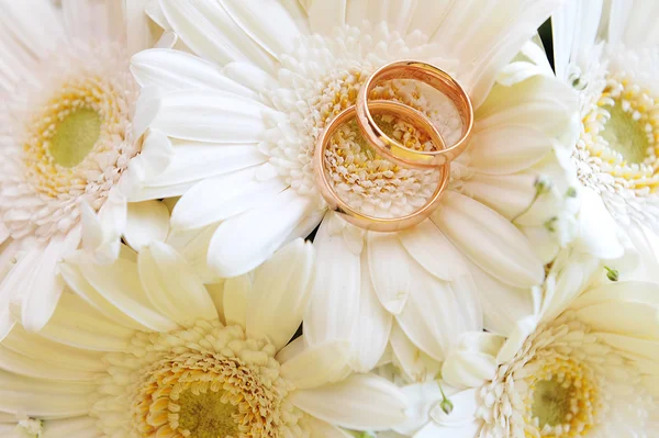 Flowers and wedding gold rings