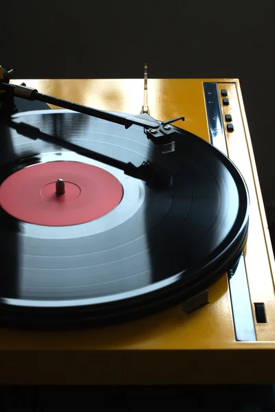 Turntable in yellow case side view isolated