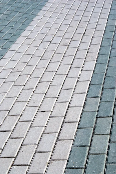 Outdoor road gray stone tiles closeup