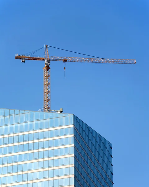 Crane in skyscraper building construction process