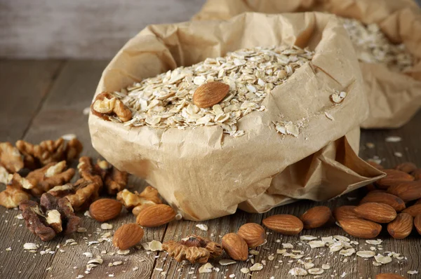 Oatmeal with nuts in paper bag