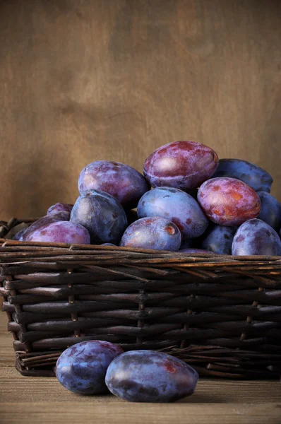 Blue plums in basket
