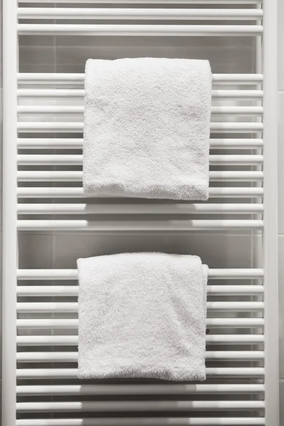 Two white towels on heating radiator
