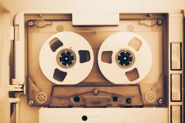 Vintage audio tape compact cassette, sepia tone with artistic film noise