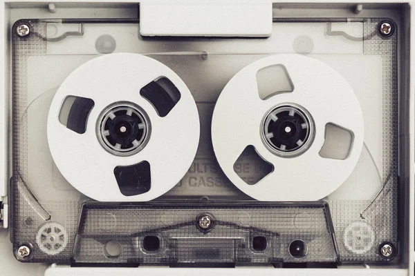Vintage audio tape compact cassette, black and white with artistic film noise
