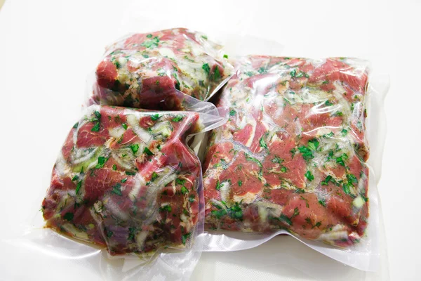 Barbecue meat in vacuum marinade bag