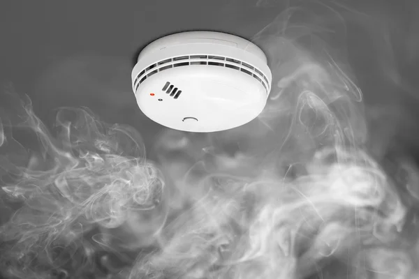 Smoke detector of fire alarm in action