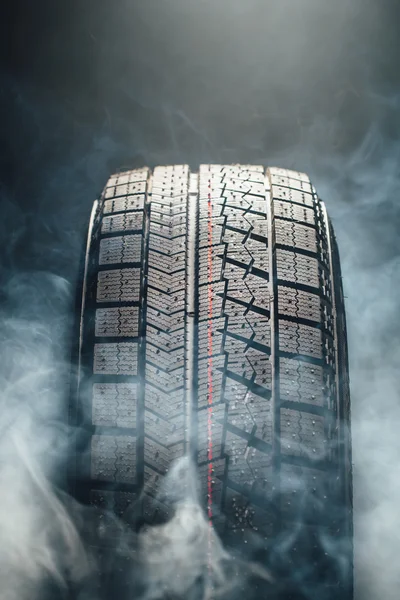 Winter tire in smoke