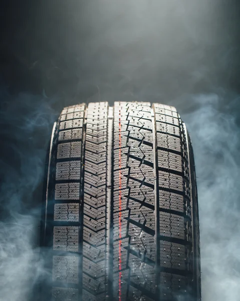 Winter tire in smoke
