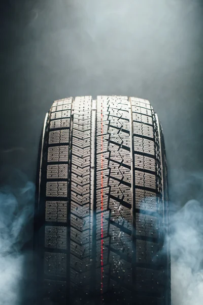 Winter tire in smoke