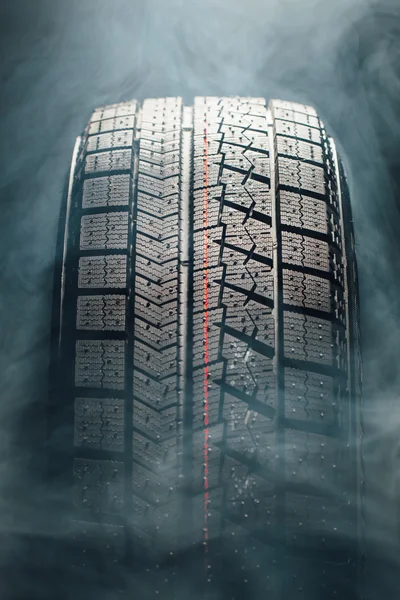 Winter tire in smoke