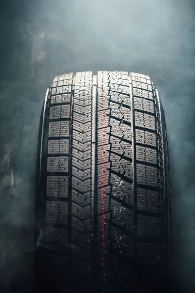 Winter tire in smoke