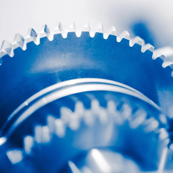 Industry background with blue gear wheels