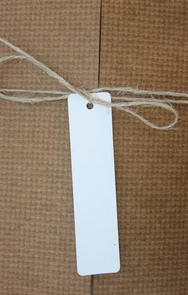 Parcel tied with white string with address label attached