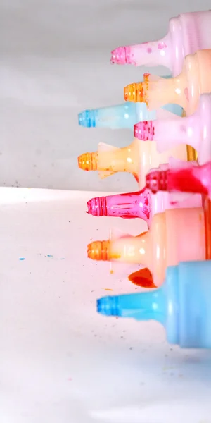 Bottles of ink printer cartridges on white background.