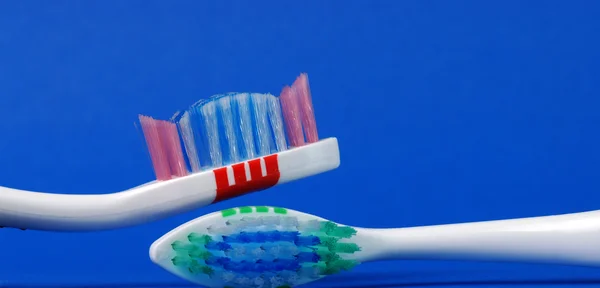 Close-up blue and red tooth brush