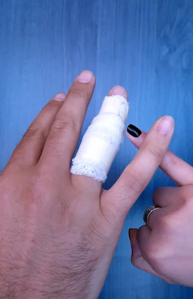 Injured painful male hand finger
