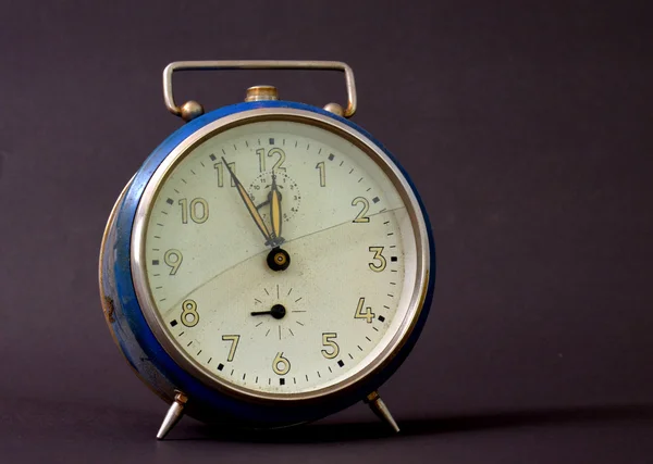 Vintage alarm clock with broken glass
