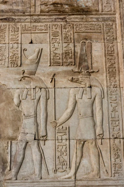 Hieroglyphic carvings on the exterior walls of  egyptian temple