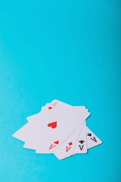 The combination of playing cards poker casino. Isolated on blue
