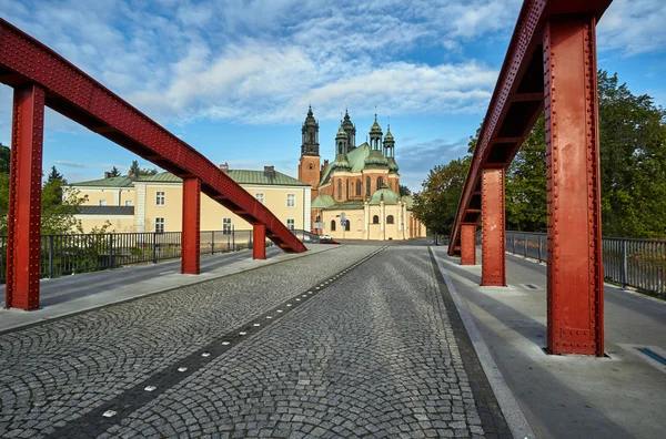 Steel bridge over the river Warta and the towers of the cathedral