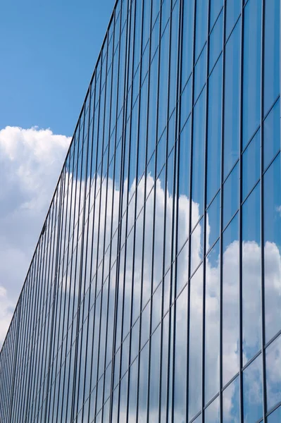 Reflection of the sky and clouds in Glass facade of a building