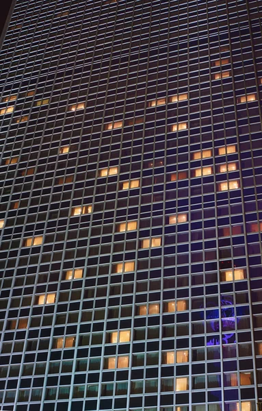 The facade of a skyscraper at night in Berlin