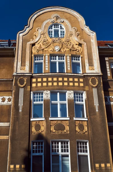 Windows on the facade of the Art Nouveau building in Poznan