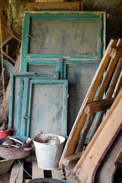 Storage room full with old objects, window frames