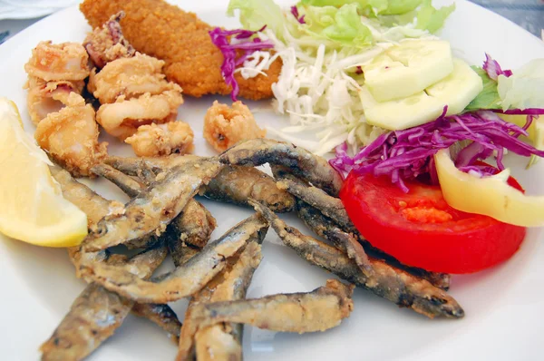 Deep fried seafood with fresh salad
