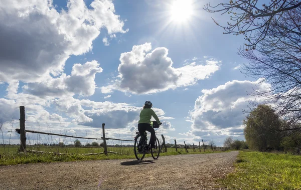 A cyclist in her first bike ride in the spring