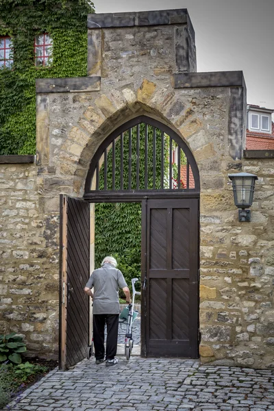 An old man running with a help