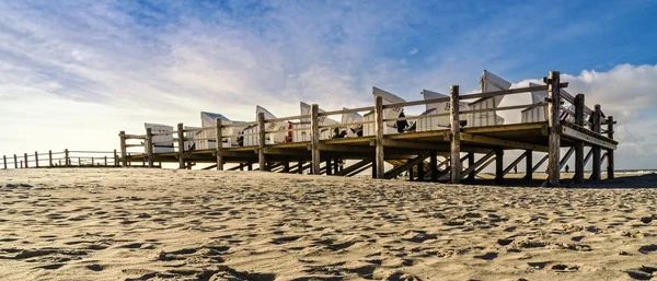 Wooden platforms on the North Sea beach