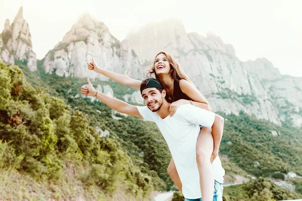 Beautiful young couple enjoying nature on mountain.