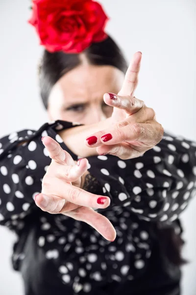 Pretty young flamenco dancer in beautiful dress.