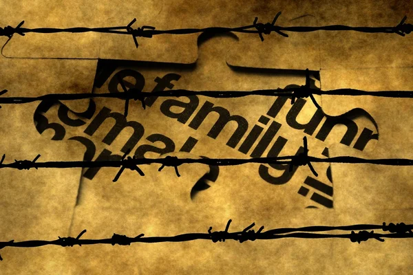 Family puzzle concept against barbwire