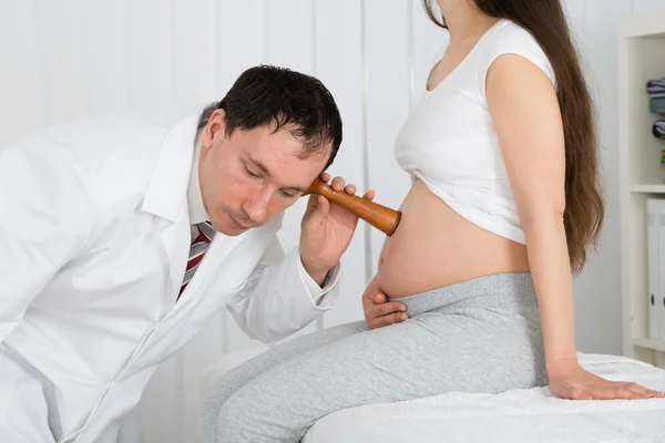 Doctor Listening To Heart Rate Of Baby
