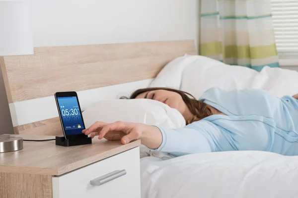 Woman Snoozing Alarm