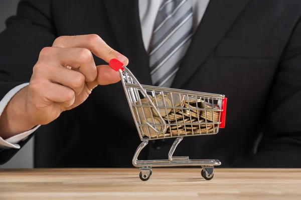 Businessman Carrying Coin In Shopping Trolley