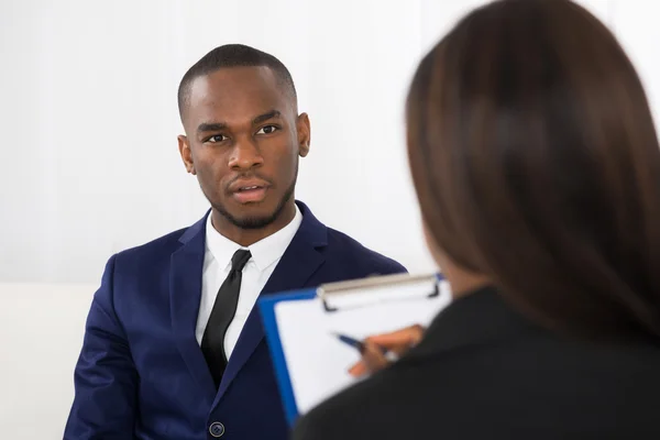 Young Man Talking With Psychologist